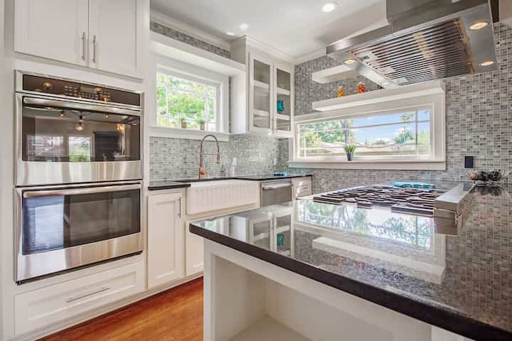 An image of a modern kitchen with sleek appliances, featuring a gas stove, refrigerator, and built-in microwave in Port Charlotte